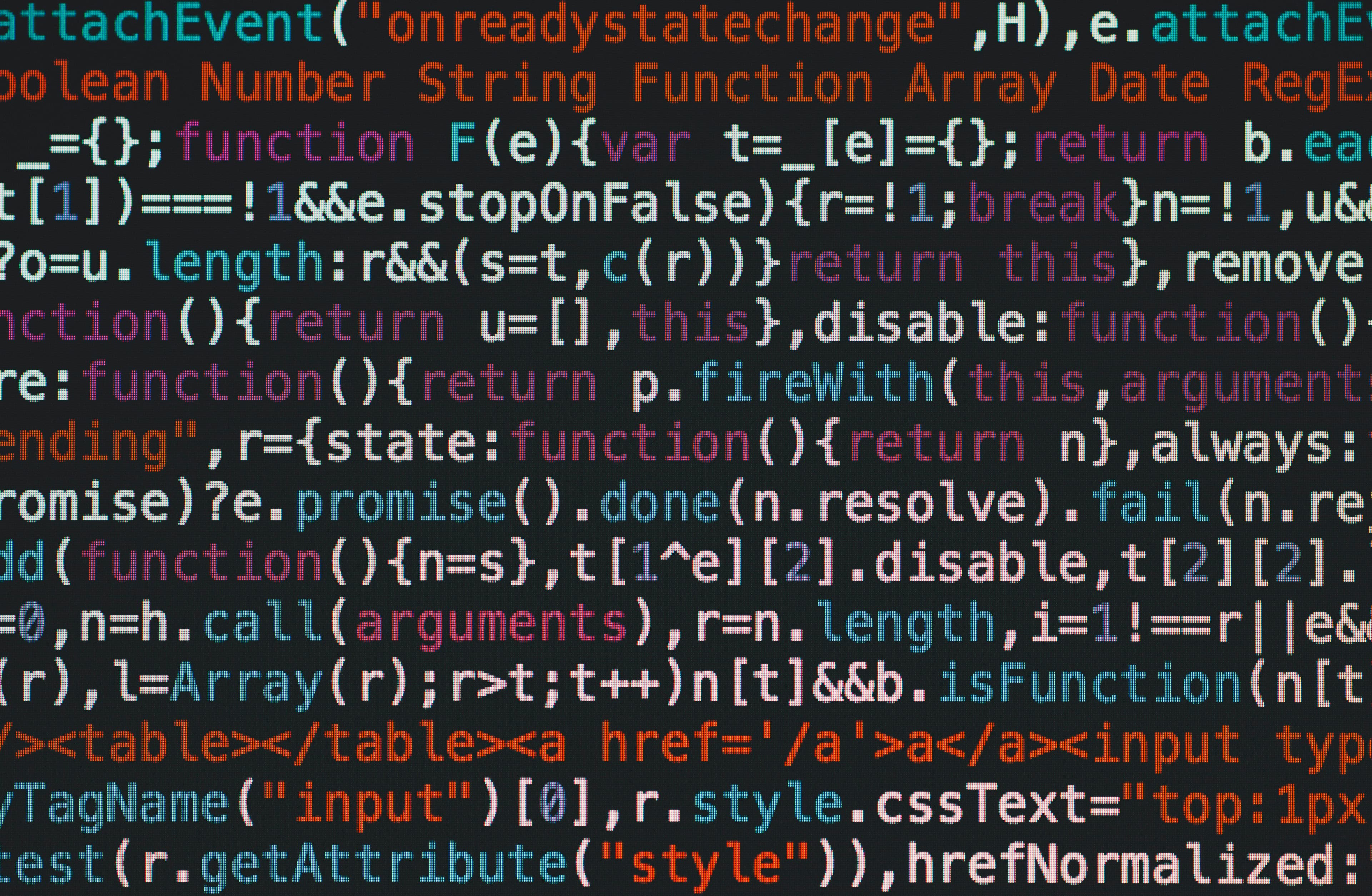 Lignes de code JavaScript colorées affichées sur un écran sombre