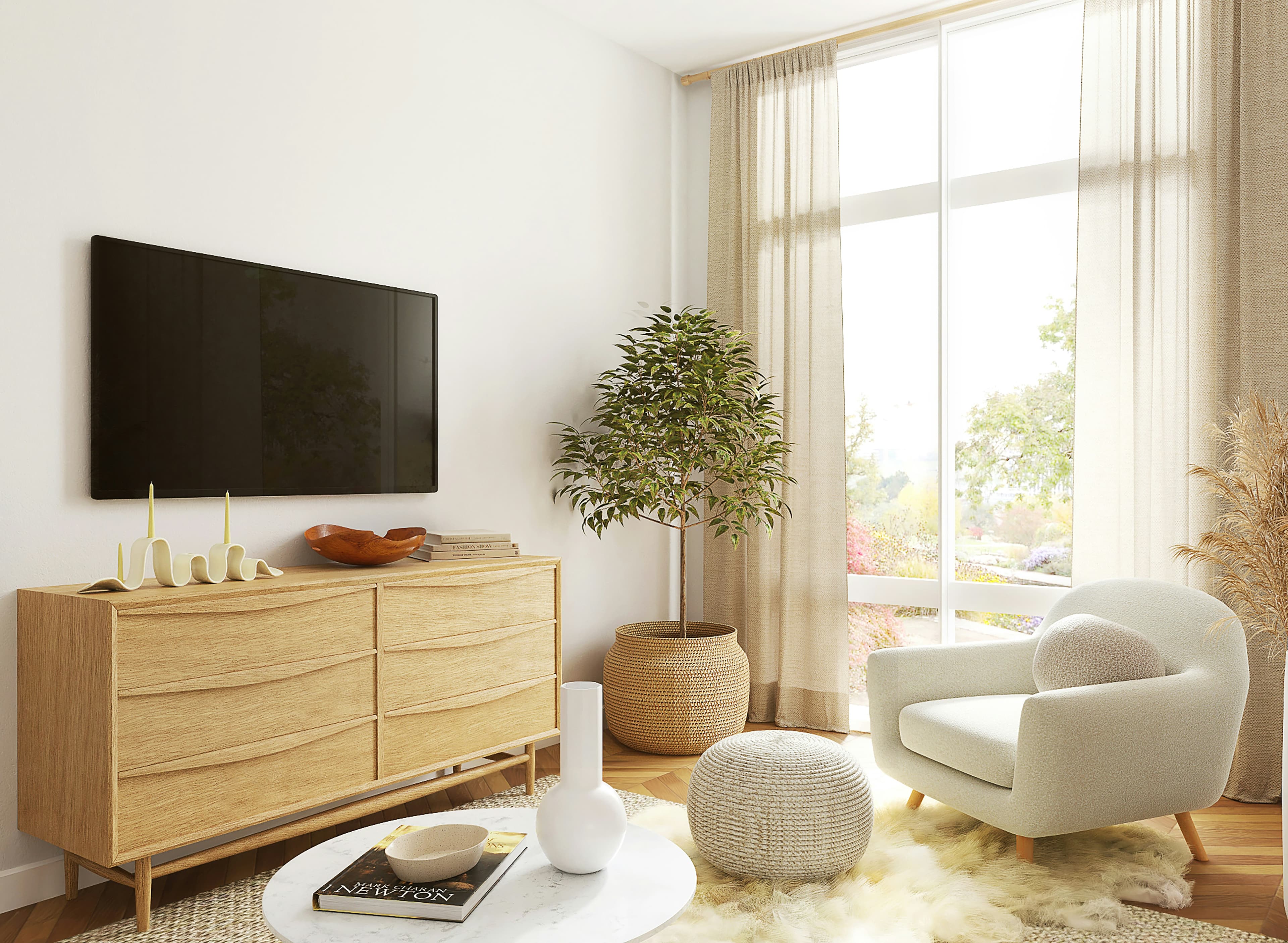 Un salon avec un grand téléviseur à écran plat